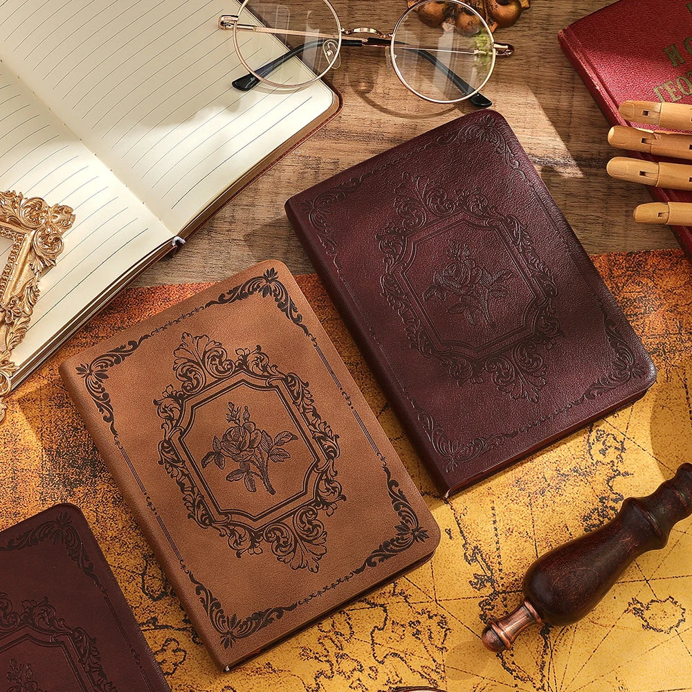 Leather bound journals on table