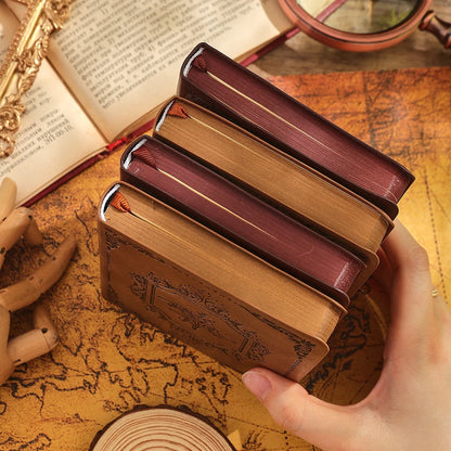 Leather bound journals on table